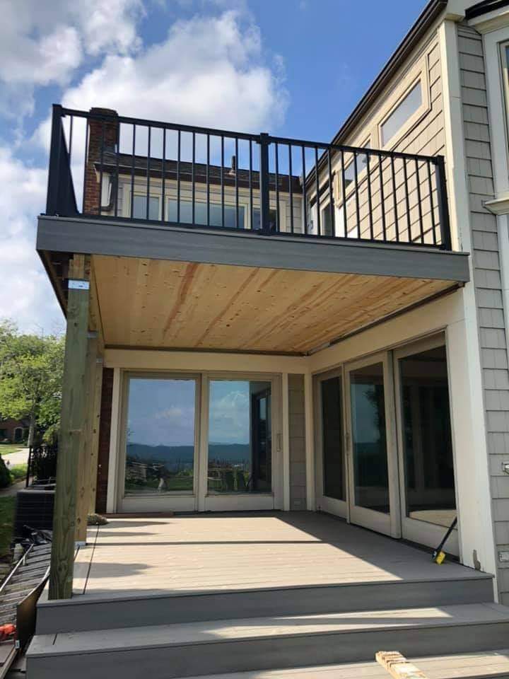 covered deck with a second-story deck