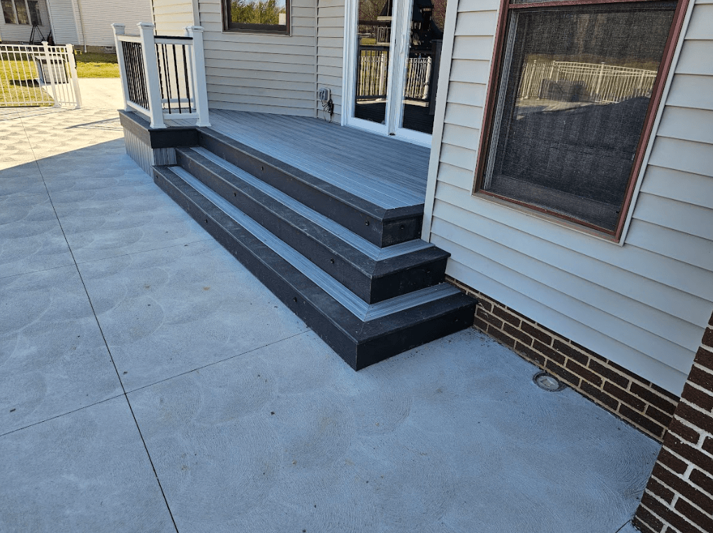 photo of a custom deck and concrete patios - Patio and pavers design ideas