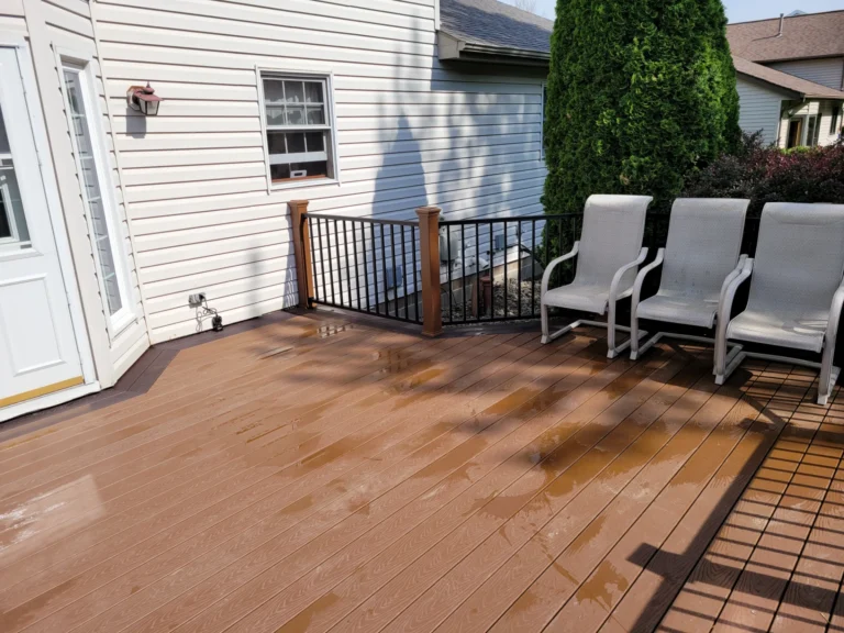 Deck Featuring Several Chairs Surrounded by a Residential Property