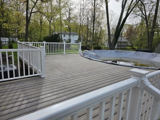 photo of a partially surrounded pool deck