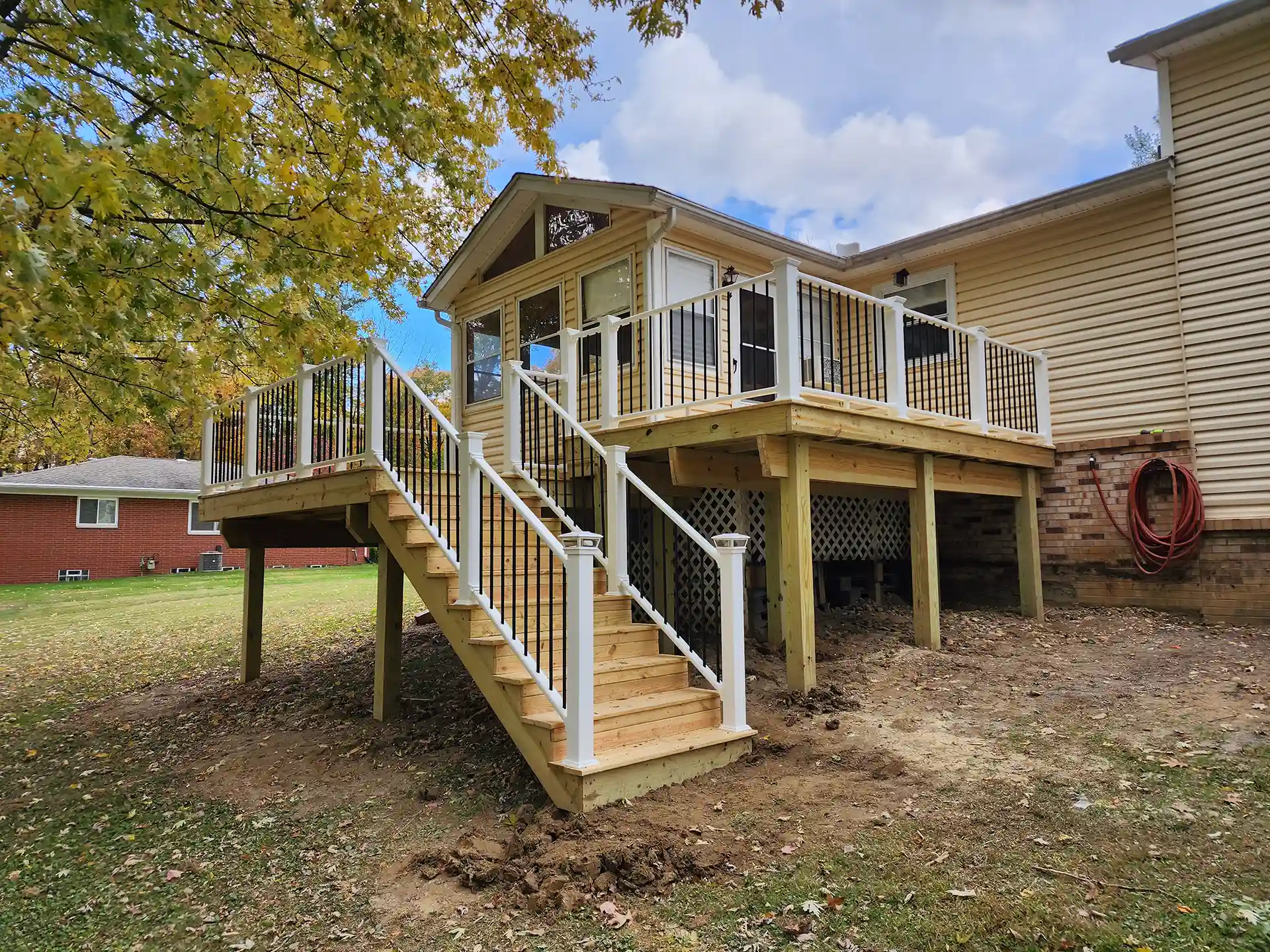 Photo of an elevated wooden deck made with treated wood